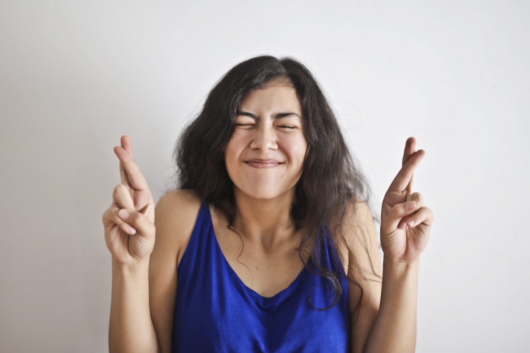 woman-in-blue-tank-top-smiling-3807762